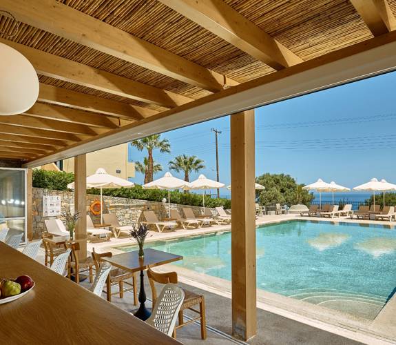 Marni Village outdoor pool bar near the shared pool with umbrellas and sunbeds