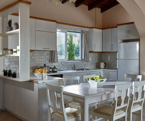 Marni Hotel Superior Family Suite Private Pool spacious kitchen with modern design, dining table and garden window view