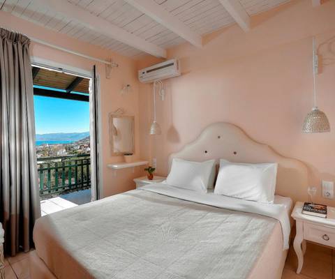 Marni Hotel Family Suite bedroom with double bed and private balcony with view