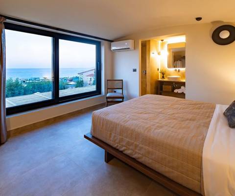 Marni Hotel Luxury two Bedroom Villa Private Pool bedroom with large windows with sea view