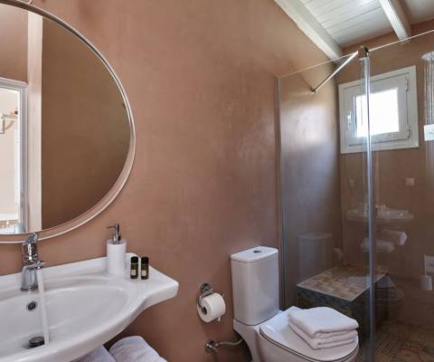 Marni Hotel Superior Studio bathroom with walk-in shower and round mirror
