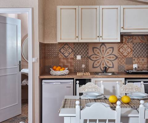 Marni Hotel Premium One Bedroom Apartment kitchenette with patterned tiles and dining table