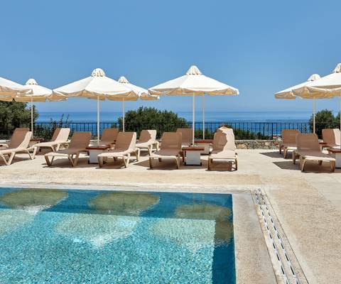 Marni Village shared pool area with umbrellas and sunbeds