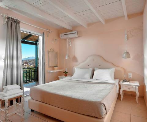 Marni Hotel Family Suite bedroom with double bed and private balcony with view