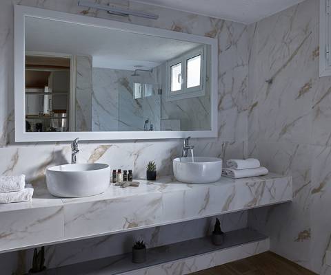 Marni Hotel Superior Family Suite Private Pool bathroom with marble countertop sinks and large mirror