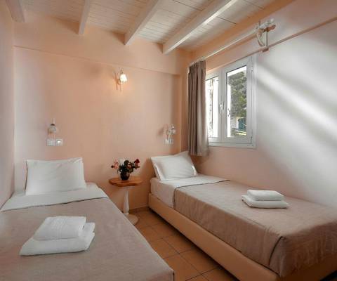 Marni Hotel Family Suite bedroom with two single beds and window