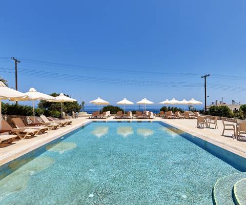 Marni Village shared pool area with umbrellas and sunbeds