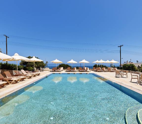 Marni Village shared pool area with umbrellas and sunbeds