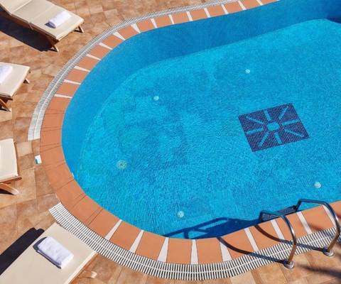 Marni Hotel Villa outdoor pool with sunbeds