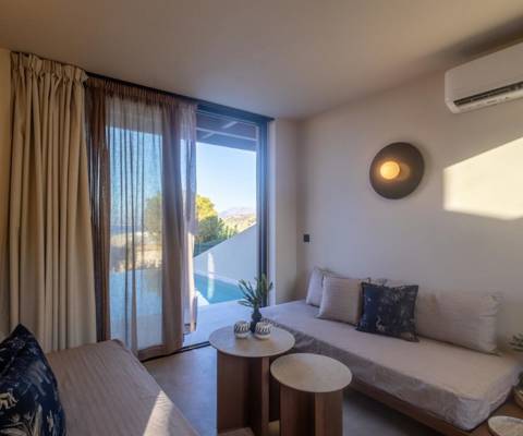 Marni Hotel Luxury One Bedroom Villa living room with two sofas, modern coffee tables and access to private pool area