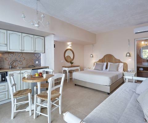 Marni Hotel Studio Private Pool open-plan layout with bed, sofa, kitchenette and dining area