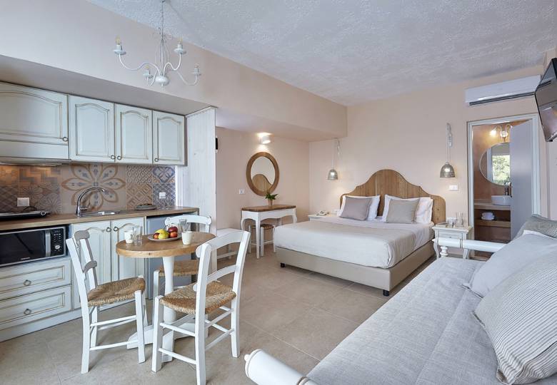 Marni Hotel Studio Private Pool open-plan layout with bed, sofa, kitchenette and dining area