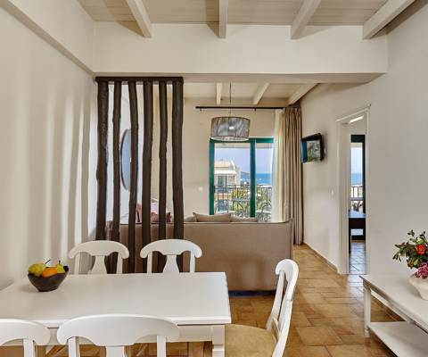 Marni Hotel Superior Suite living and dining area with wooden designer separator and private balcony