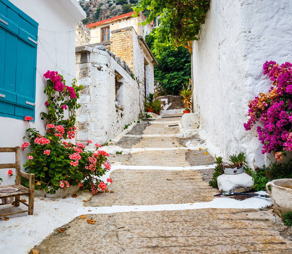 Kritsa Village traditional alley with stone road and buildings