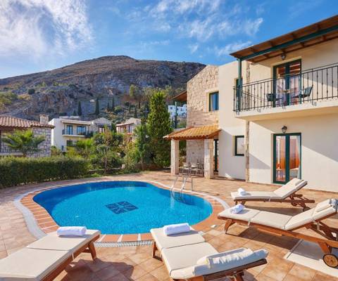 Marni Hotel Villa outdoor pool area with sunbeds