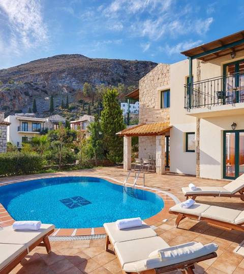 Marni Hotel Villa outdoor pool area with sunbeds