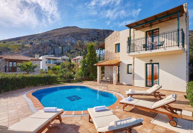 Marni Hotel Villa outdoor pool area with sunbeds