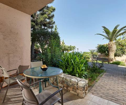 Marni Hotel Superior One Bedroom Apartment private terrace with seating area and sea view