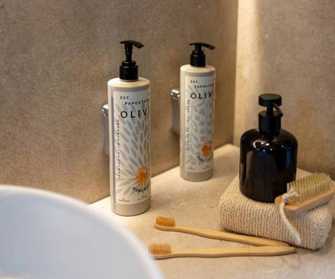 Marni Hotel Luxury One Bedroom Villa bathroom amenities featuring olive oil products and vanity kit