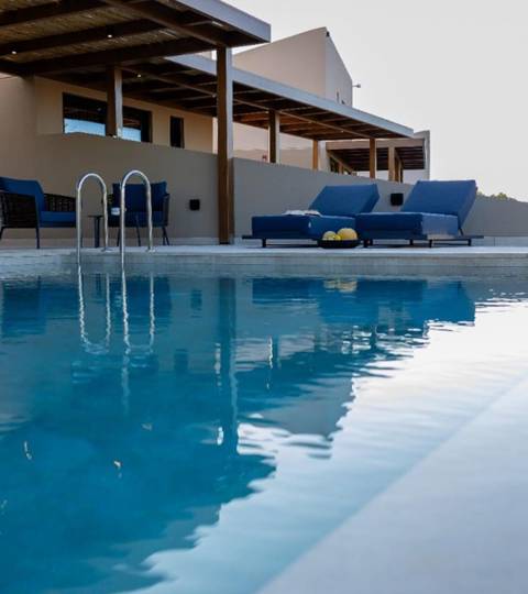 Marni Hotel Luxury One Bedroom Villa outdoor pool area with wooden pergola, sitting area and sunbeds