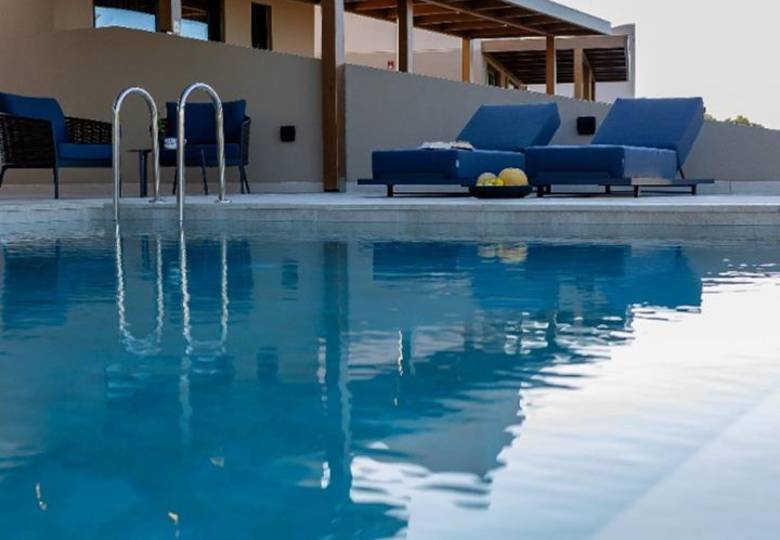 Marni Hotel Luxury One Bedroom Villa outdoor pool area with wooden pergola, sitting area and sunbeds