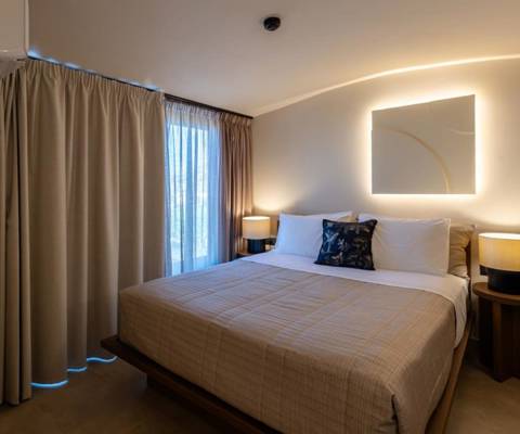 Marni Hotel Luxury One Bedroom Villa Bedroom with modern lighting, bedside tables and blackout curtains