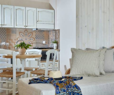 Marni Hotel One Bedroom Apartment Private Pool dining area with kitchenette, dining table near the living area