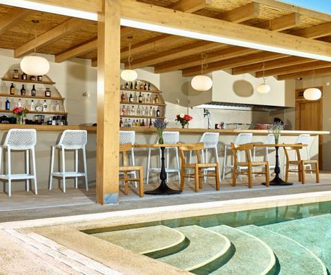 Marni village bar under wooden pergola near the pool