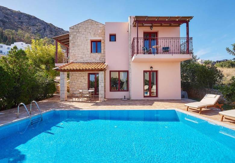 Marni Hotel Villa outdoor view from the pool area with sunbeds