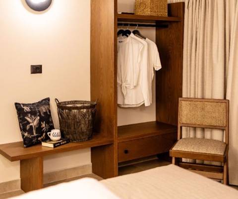 Marni Hotel Luxury Two Bedroom Villa bedroom with open wardrobe and blackout curtains