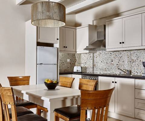 Marni Hotel Villa spacious kitchen with dining table and modern design